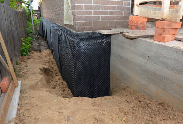 Happy homeowners after waterproofing job in Ashville